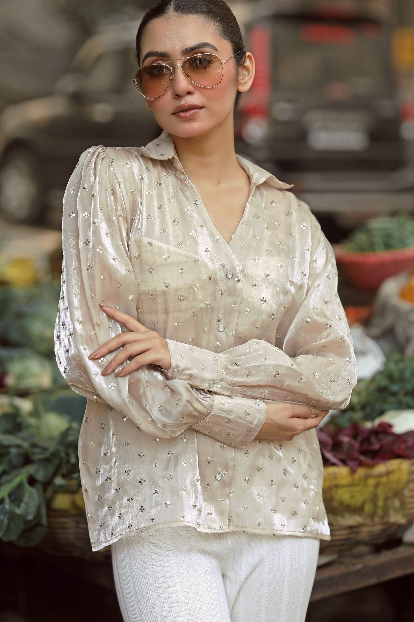 Black LOUD LUXURY shirt by 66aura displayed on a hanger with stylish design details visible.