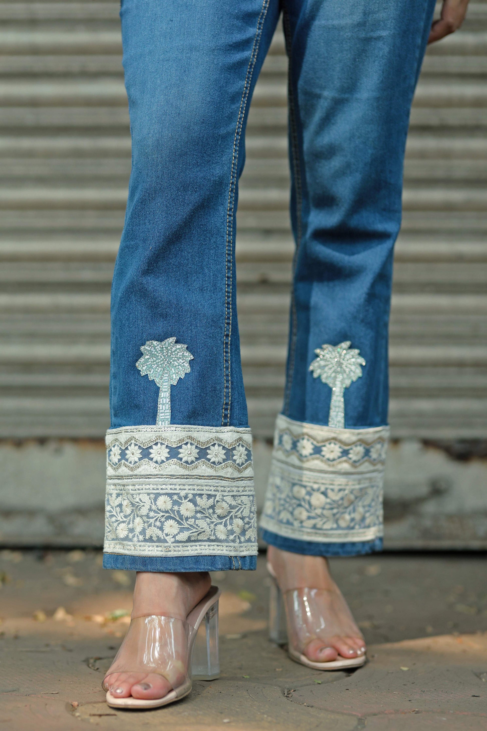 Hot Mess jeans by 66aura showing distressed denim with frayed hems and a slim fit style.