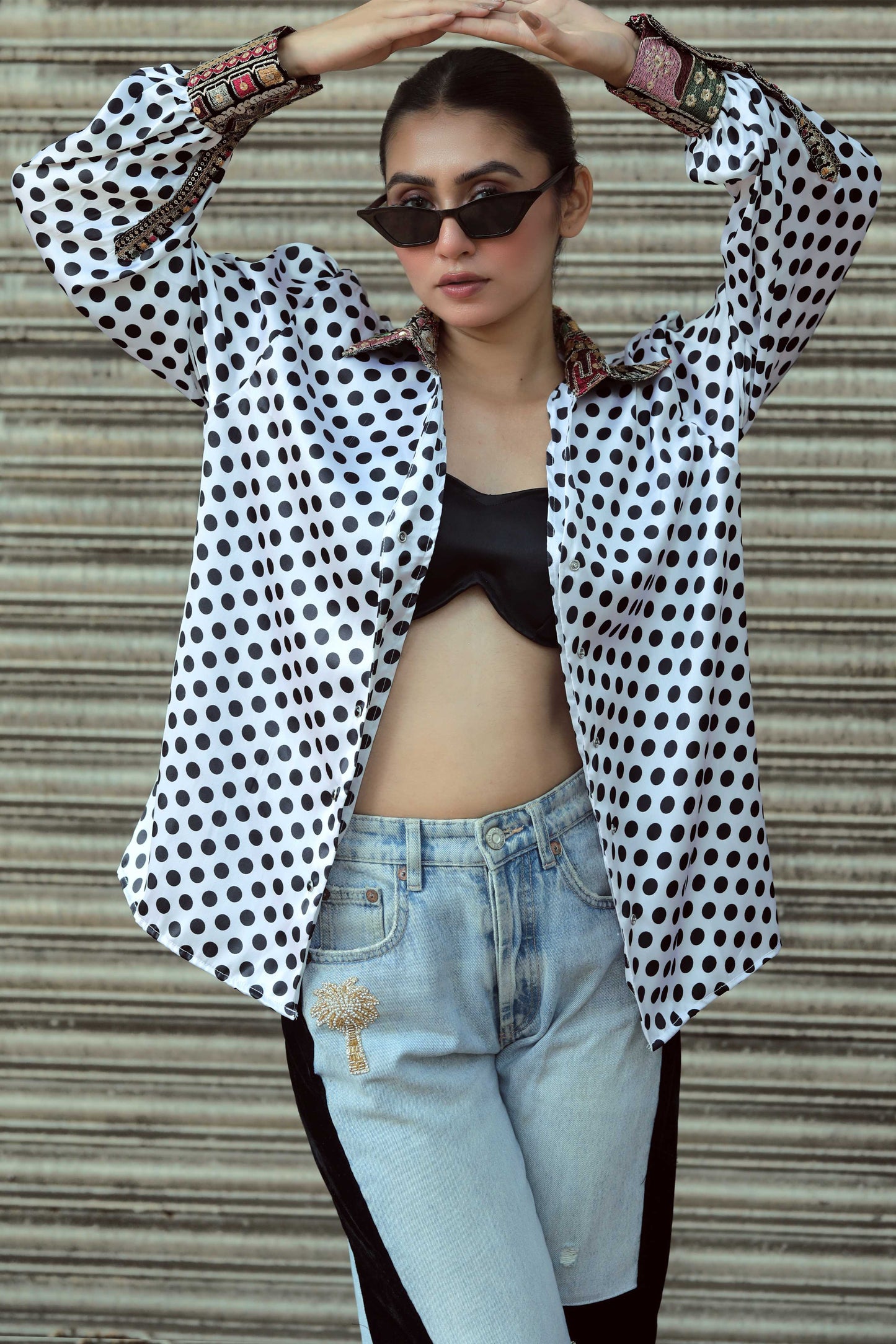 Black Plot Twist shirt by 66aura featuring a casual fit and graphic design on the front, displayed on a white background.