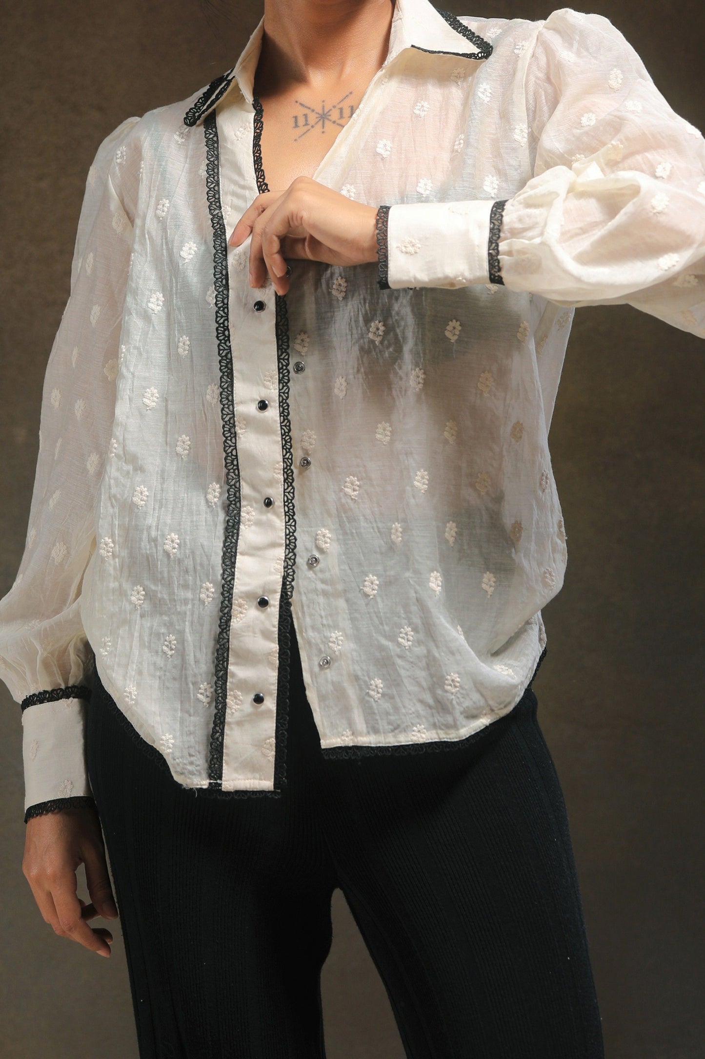 Oversized Blink Blink shirt by 66aura, featuring relaxed fit and bold design, displayed on a hanger with a neutral background.