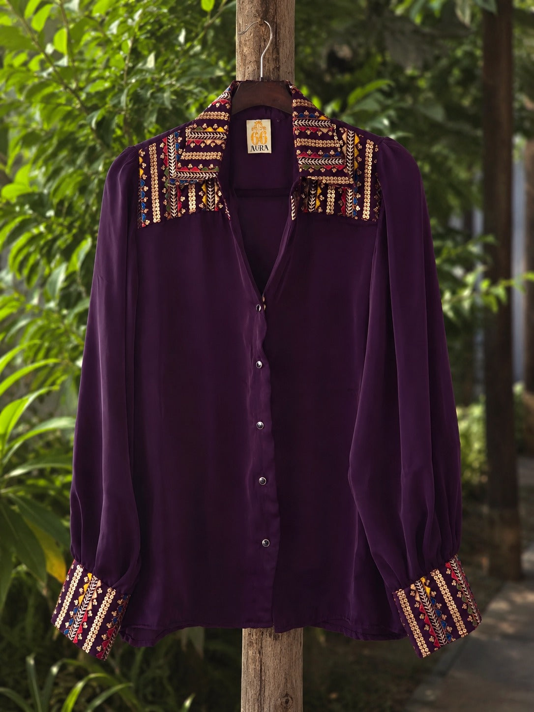 Oversized Toxic Teddy shirt by 66aura displayed on a hanger, featuring a bold graphic design and relaxed fit.