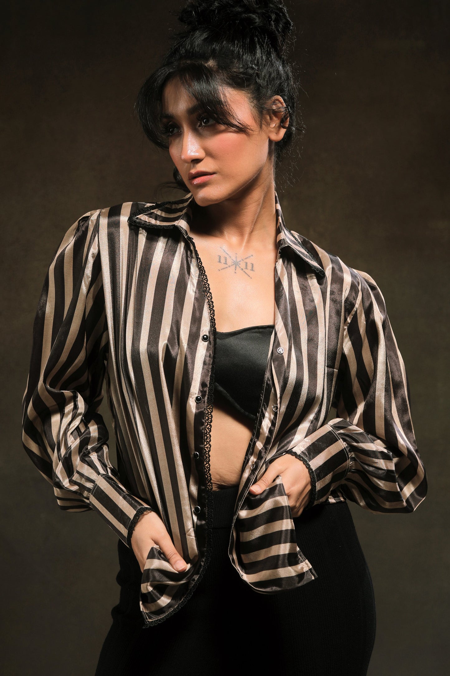 Oversized stripe spin shirt by 66aura featuring bold vertical black and white stripes and a relaxed fit.