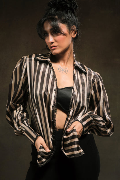 Oversized stripe spin shirt by 66aura featuring bold vertical black and white stripes and a relaxed fit.