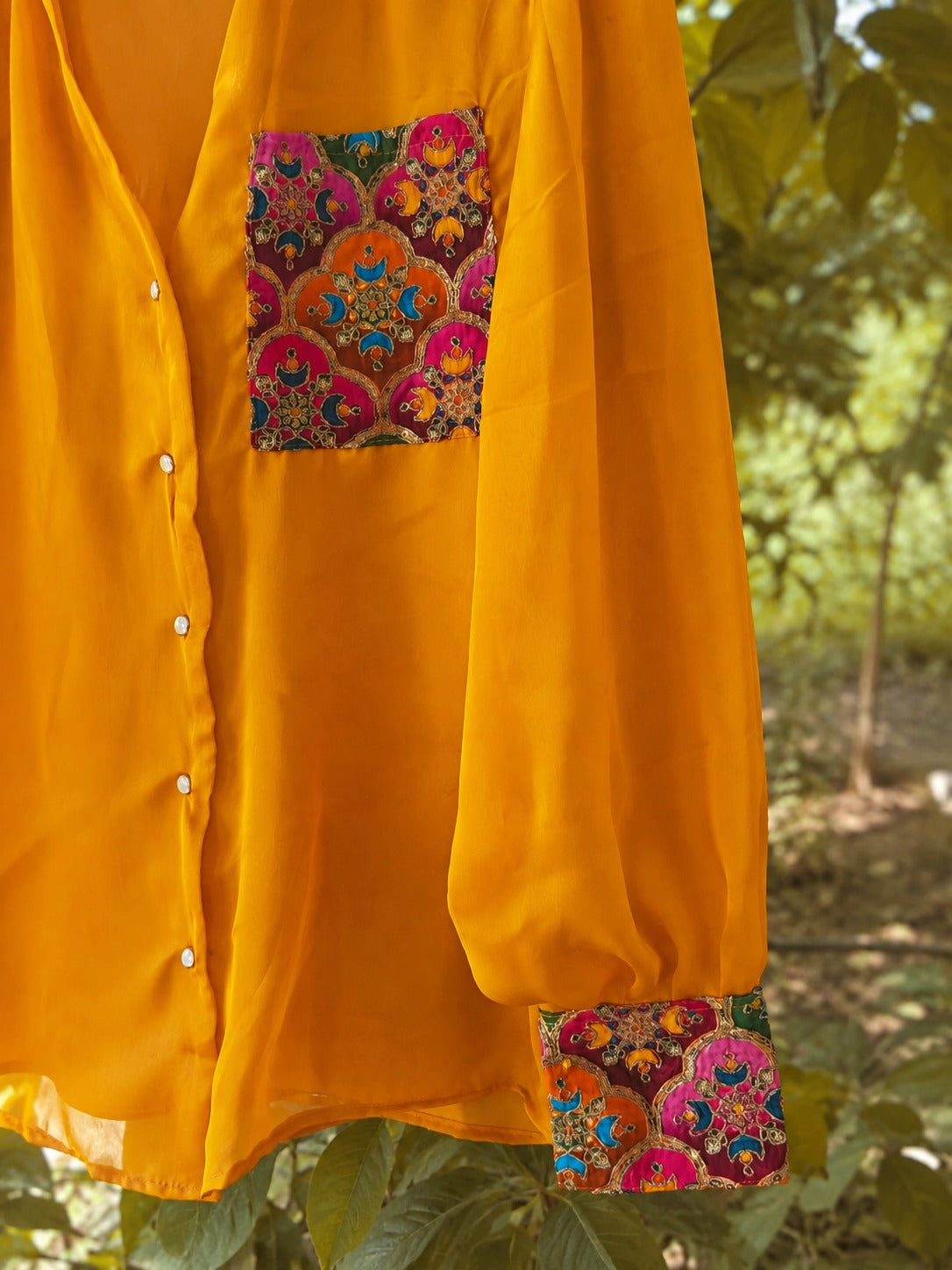 Oversized SUNNY SIDE shirt by 66aura featuring a relaxed fit, soft fabric, and stylish design, displayed on a hanger.