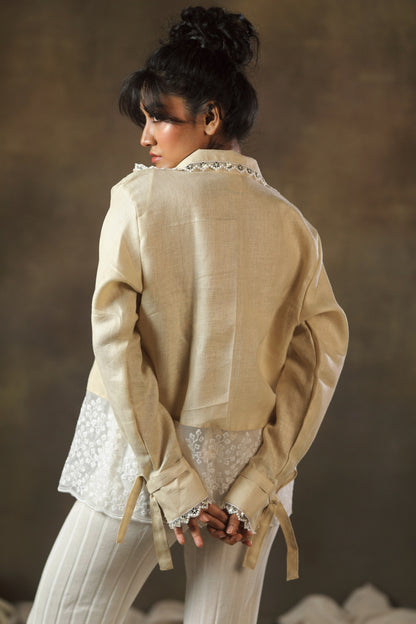 Tan Twist oversized shirt by 66aura displayed on a hanger, featuring a relaxed fit and casual style.