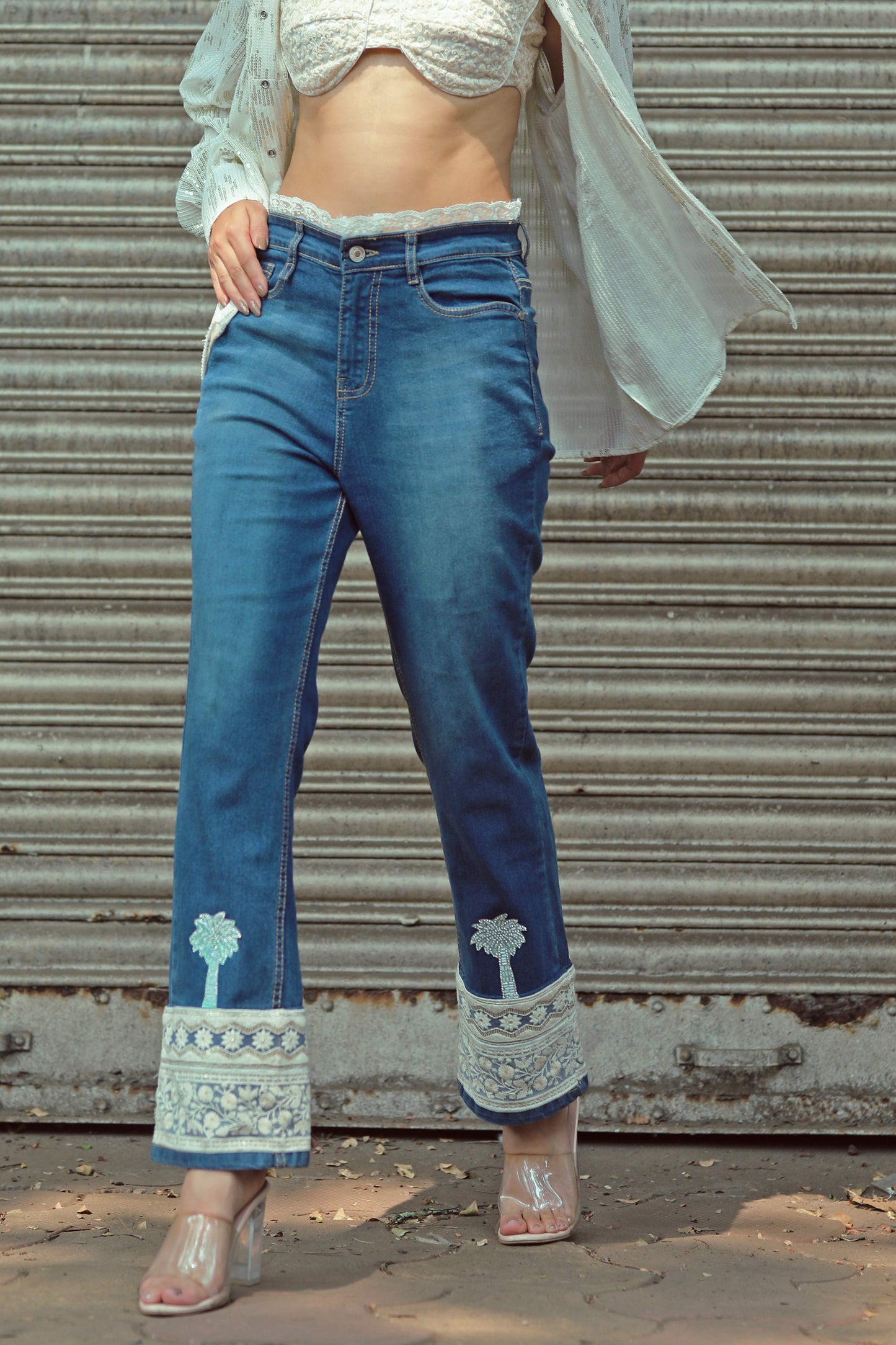 Hot Mess jeans by 66aura featuring distressed denim and a relaxed fit, shown on a model with casual streetwear style.