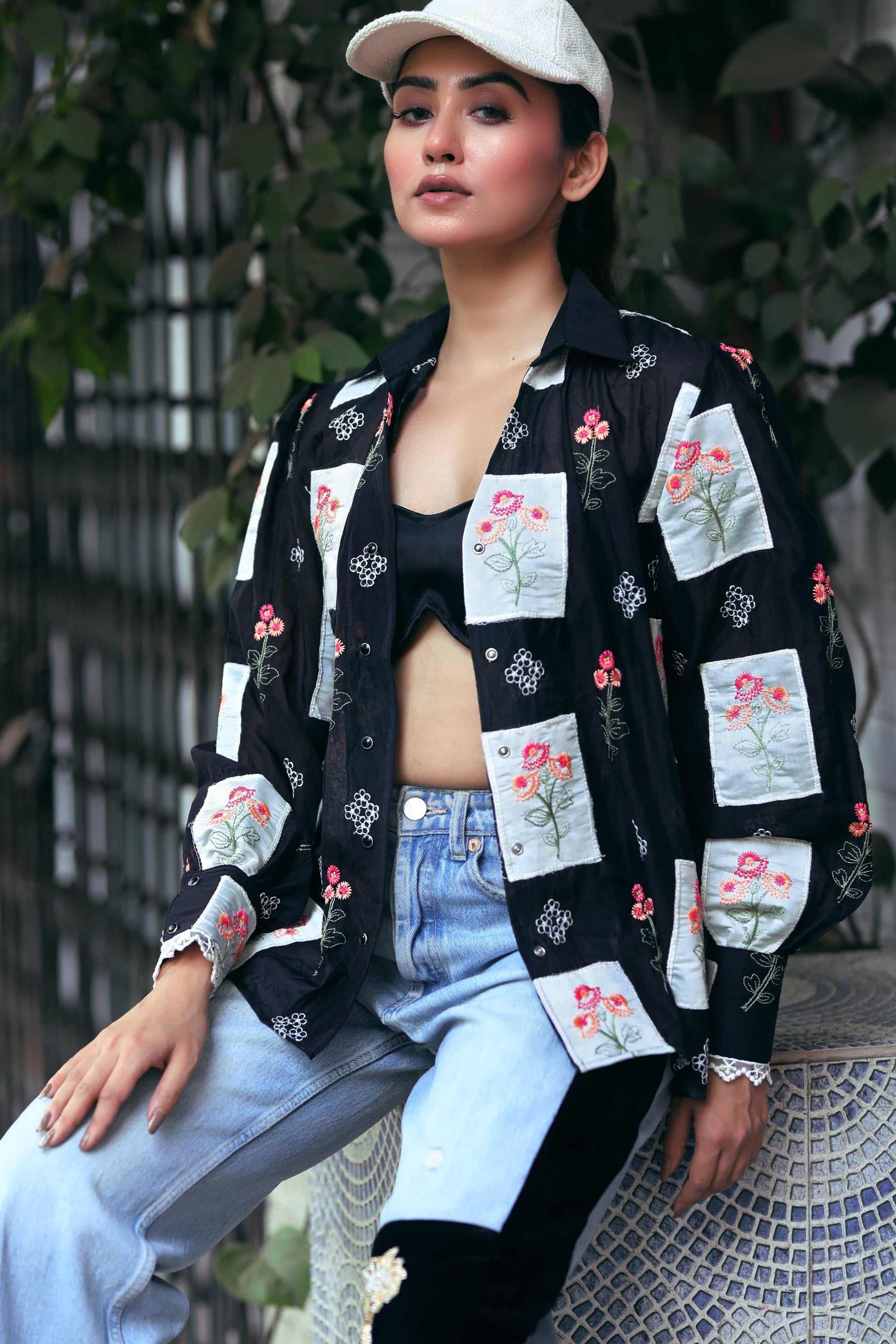 66aura VIBE CHECK shirt featuring a stylish casual design with a button-up front and vibrant pattern.