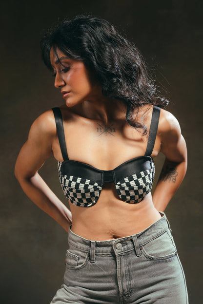 66aura Cubicle Crush Bralette featuring soft fabric, adjustable straps, and delicate lace detailing on a neutral background.