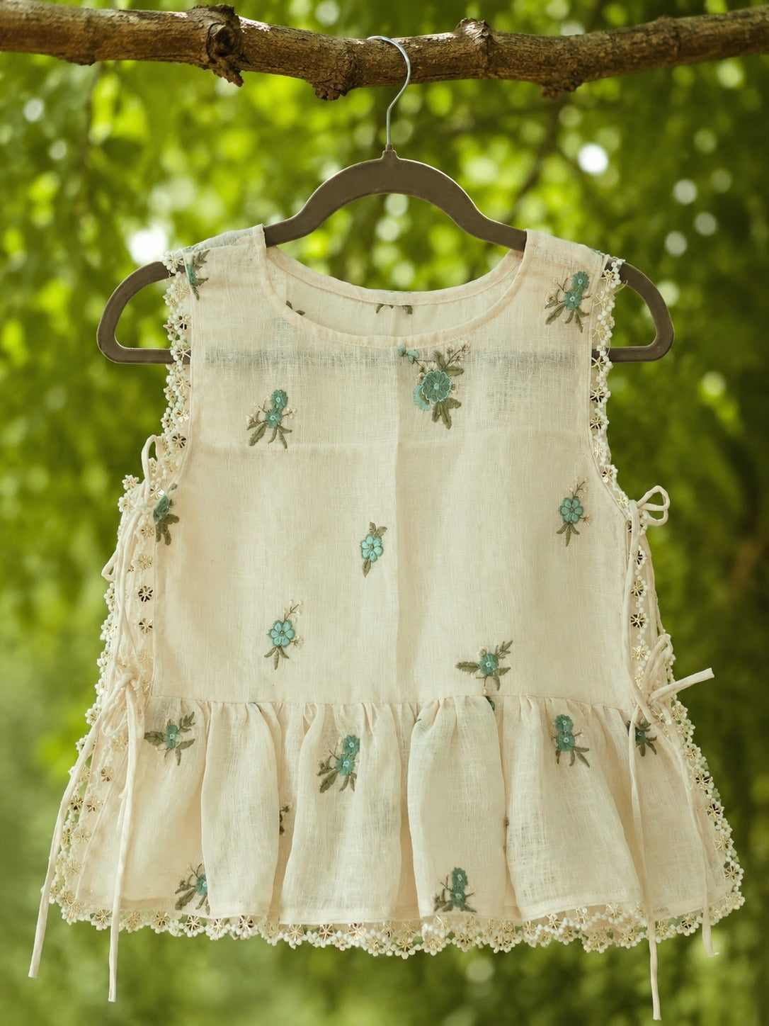 66aura Monaco Muse Top featuring a stylish, flowy design with a flattering neckline and soft fabric in a vibrant color.