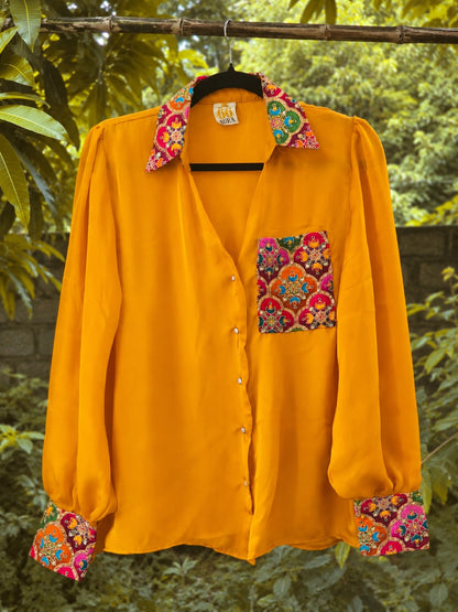 Bright yellow oversized shirt from 66aura with a relaxed fit, featuring a casual collar and long sleeves.