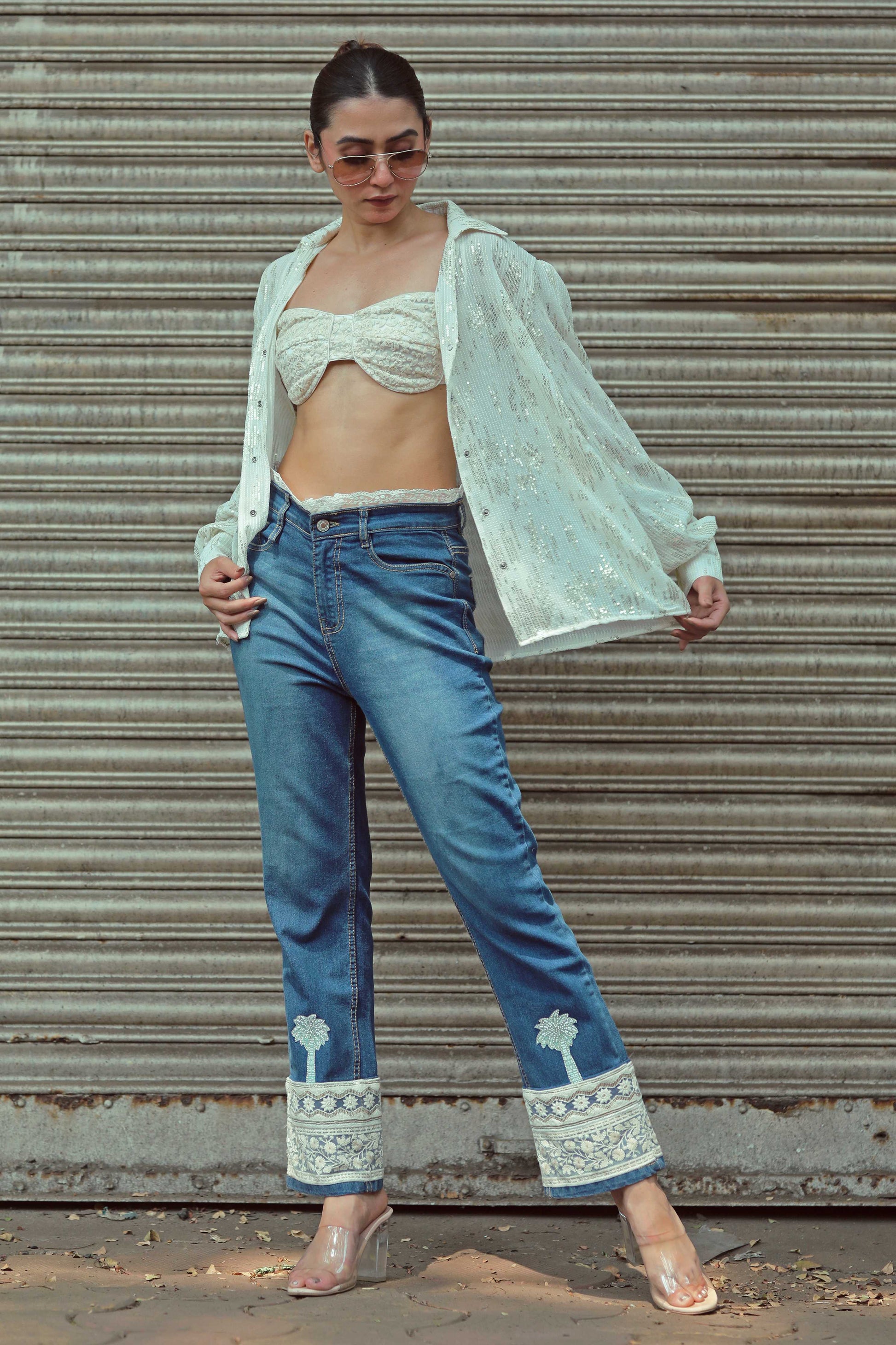 Hot Mess jeans by 66aura featuring distressed denim and a relaxed fit, shown on a model with casual styling.