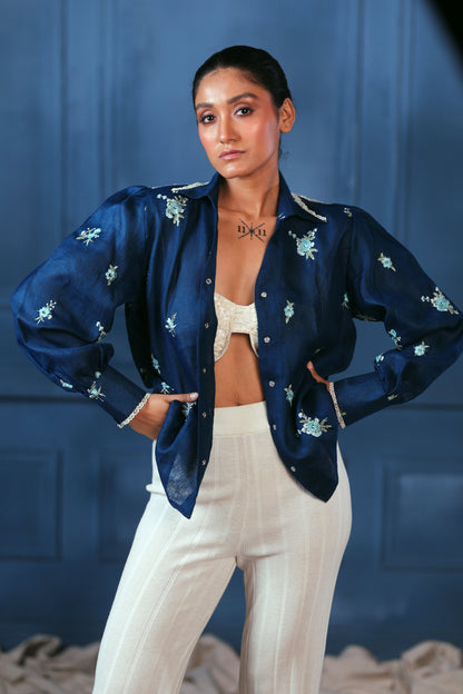 Navy Nexus oversized shirt by 66aura displayed on a hanger, featuring a relaxed fit and modern design for casual wear.