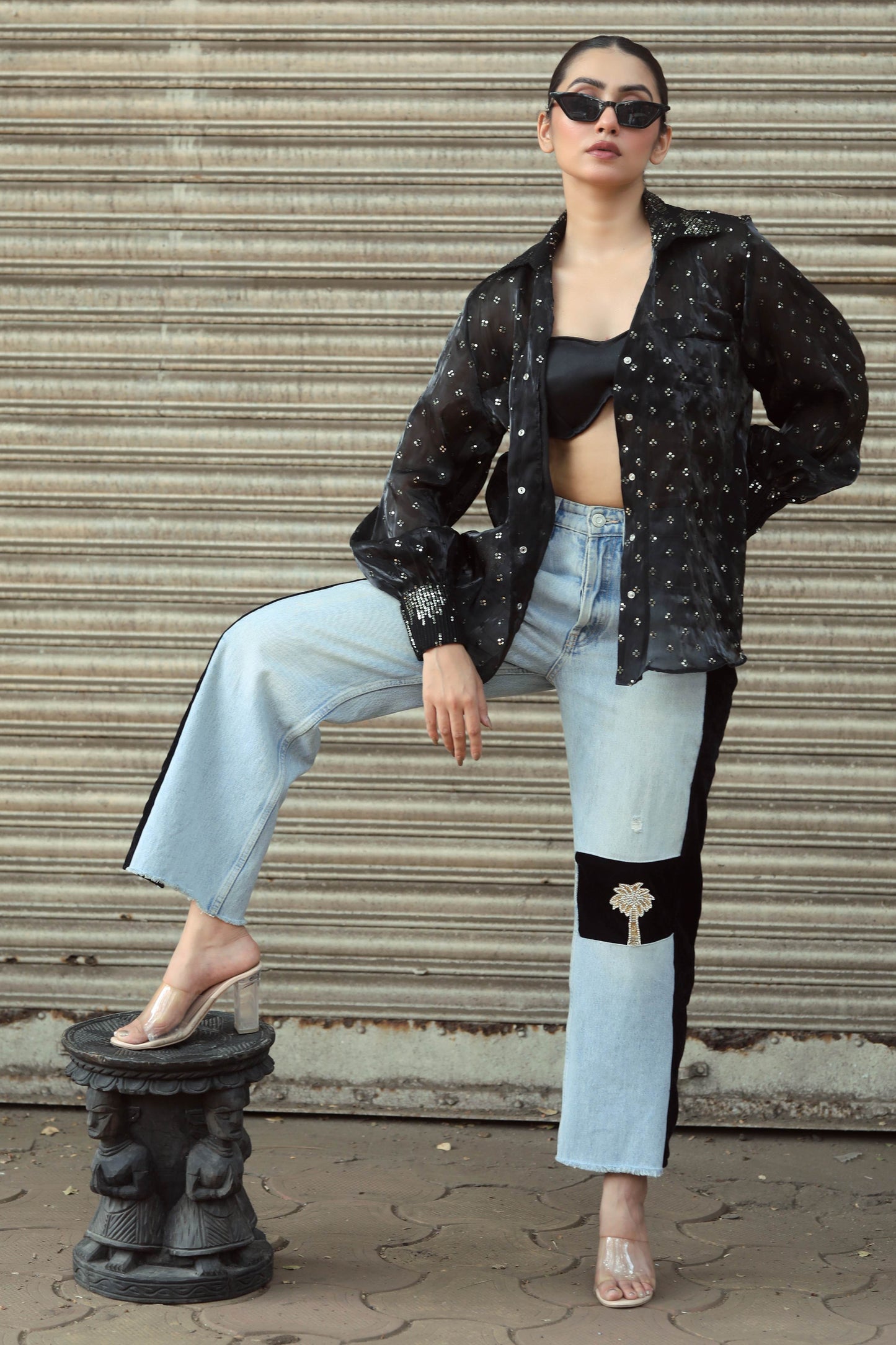 Pair of stylish BOSS BABE jeans from 66aura, featuring a classic fit with distressed details and a high-waist design.