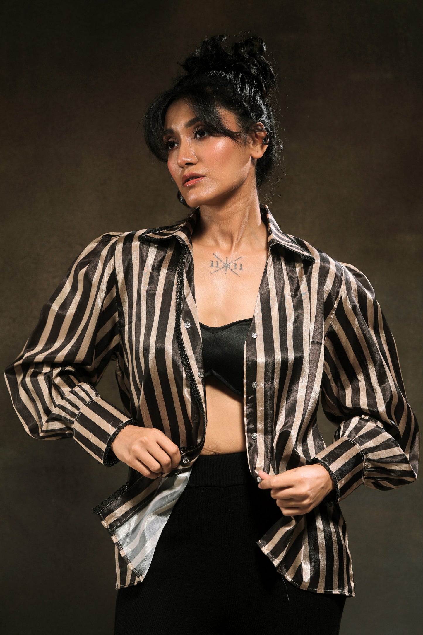 Oversized stripe spin shirt by 66aura featuring bold horizontal black and white stripes and a relaxed fit.