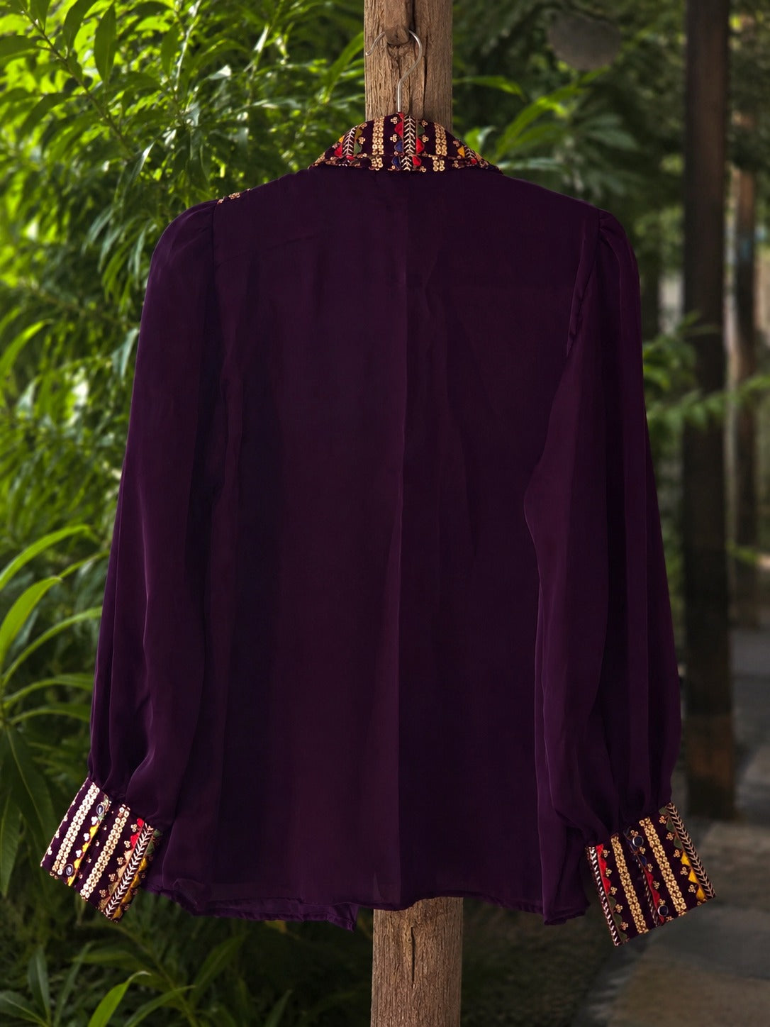 Oversized Toxic Teddy shirt by 66aura featuring a bold graphic print, relaxed fit, and soft fabric, displayed on a hanger.