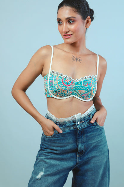 Confetti Cut Bralette by 66aura showing colorful, patterned fabric with lace details and adjustable straps.