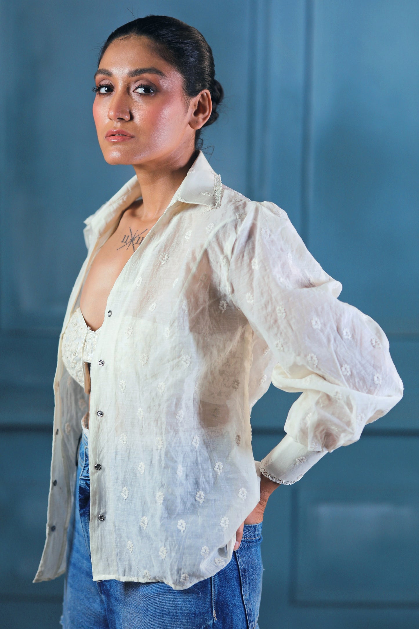 Oversized CLOUD CRAFT shirt by 66aura in soft, breathable fabric, displayed on a hanger with a relaxed fit and cloud print design.