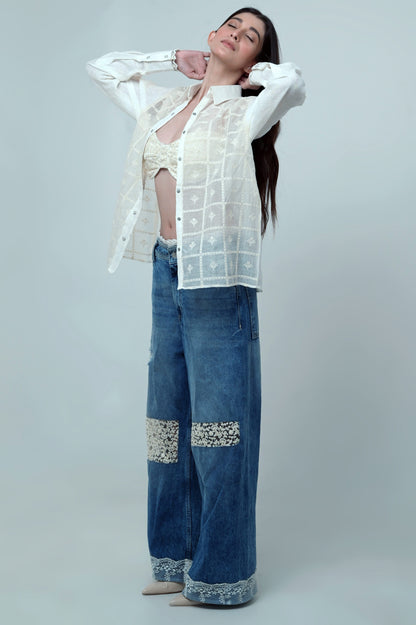 Light wash Vibe Check jeans by 66aura showing slim fit style with distressed details and classic five-pocket design.