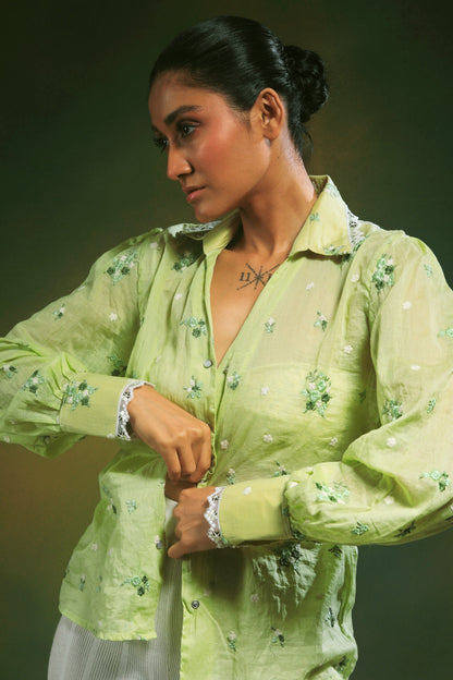 Light mint green oversized shirt from 66aura featuring a relaxed fit and casual style, displayed on a hanger.