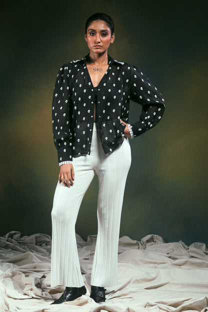 66aura Shadow Sync oversized shirt in black, featuring a relaxed fit with long sleeves and a casual, stylish design.