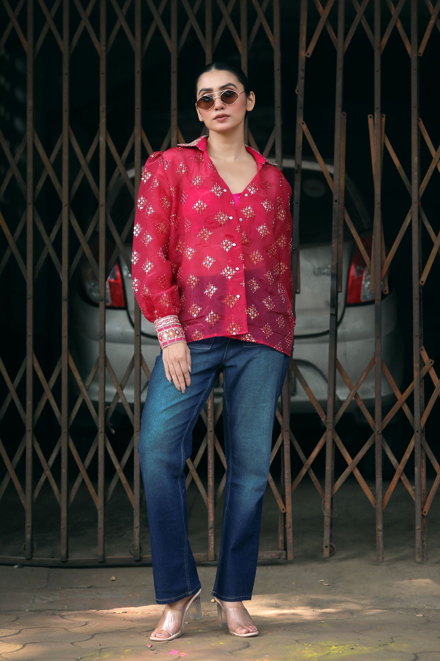 Black drip district shirt by 66aura featuring a stylish graphic print and casual fit, displayed on a hanger.