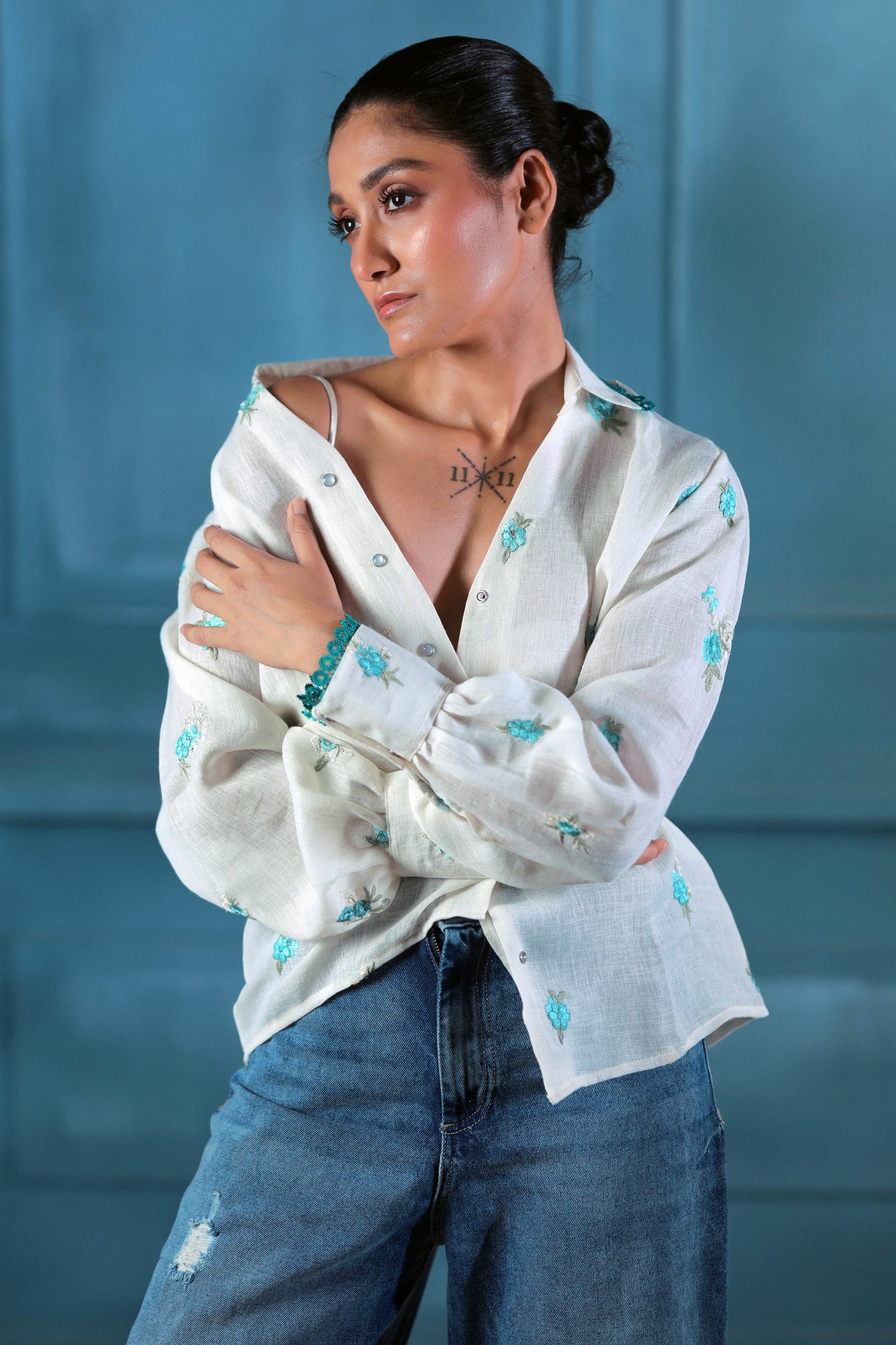 Oversized Chill Charm shirt by 66aura in soft fabric, featuring a relaxed fit and stylish design, showcased on a hanger.