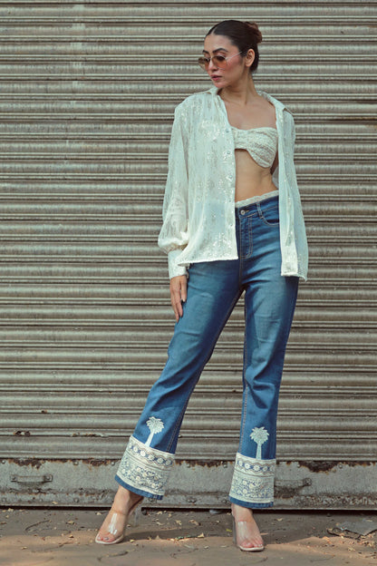 Hot Mess jeans by 66aura featuring distressed denim with rips and frayed edges, styled on a mannequin.