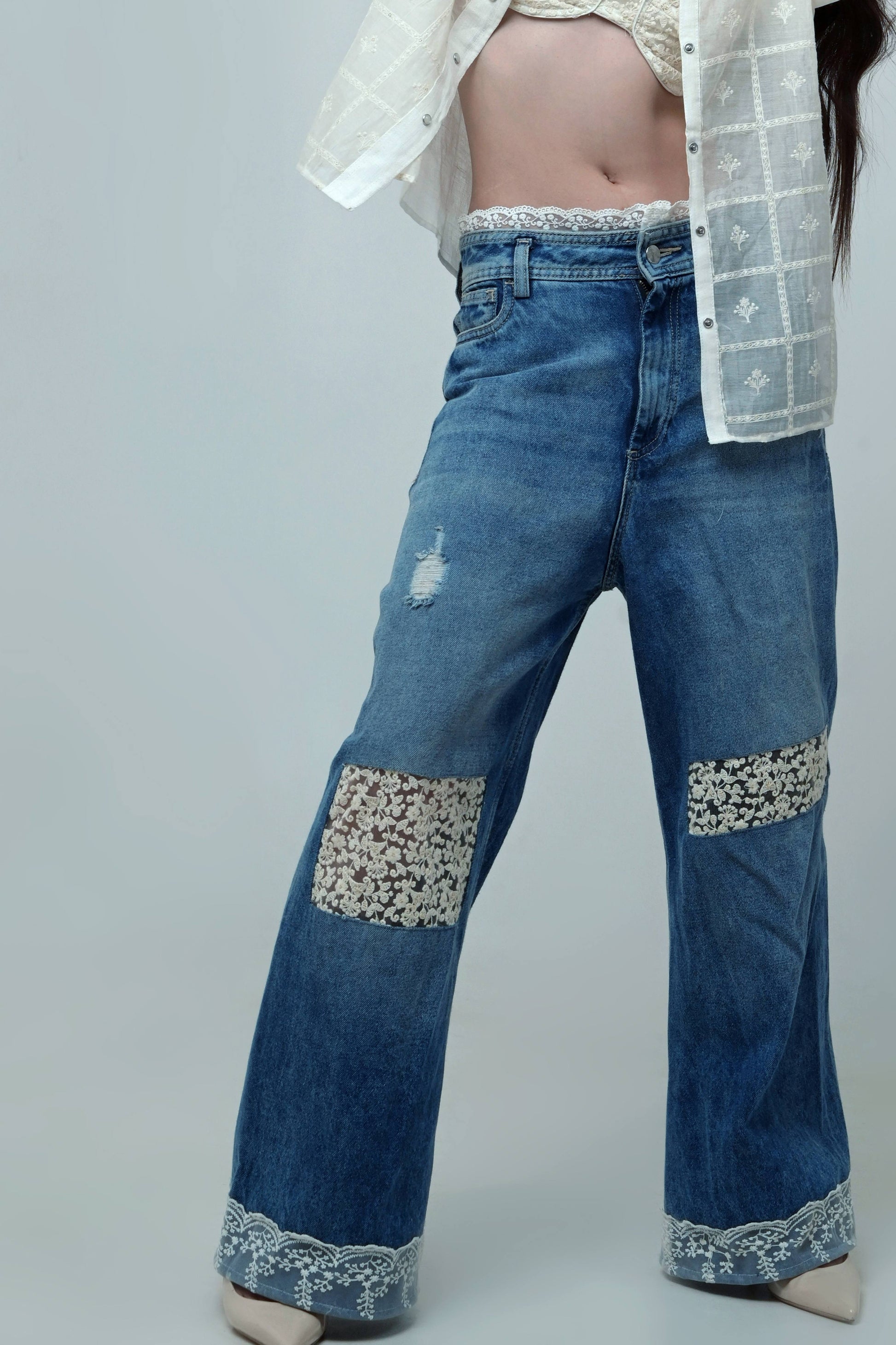 Black Vibe Check jeans by 66aura displayed on a model, showing relaxed fit and stylish denim with subtle fading.