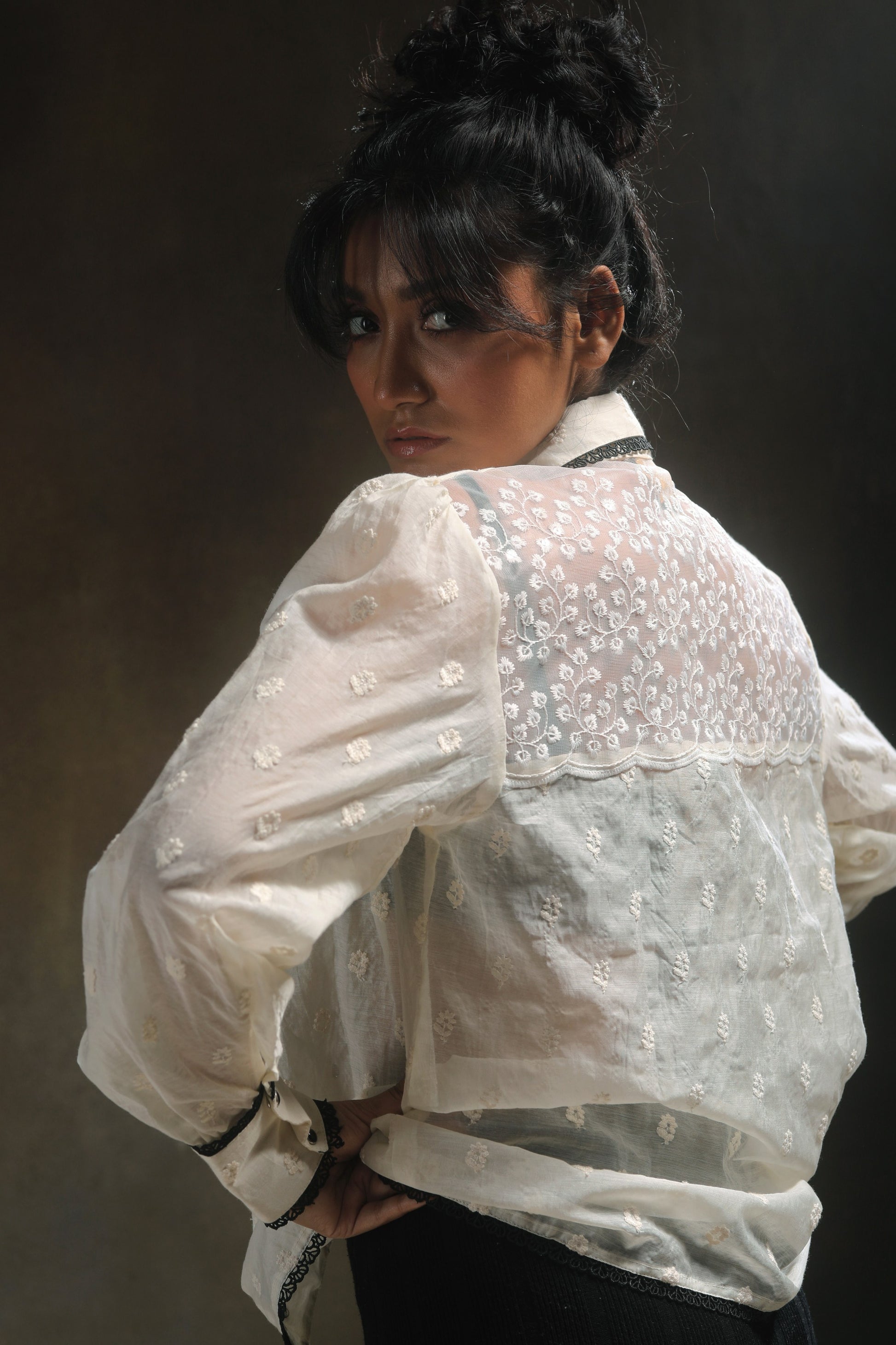 Oversized Blink Blink shirt by 66aura displayed on a hanger, featuring a relaxed fit and casual style in soft fabric.