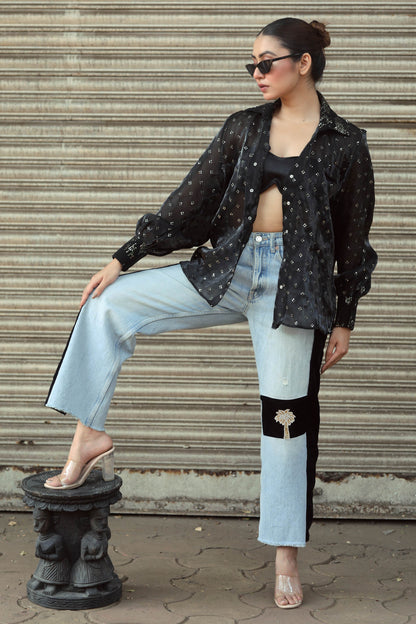 Pair of BOSS BABE jeans by 66aura featuring a high-waisted fit and classic denim wash, displayed on a hanger.