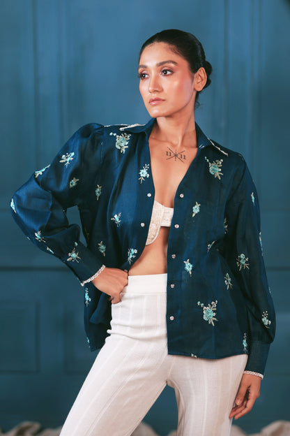 Navy Nexus oversized shirt by 66aura displayed on a hanger, featuring a relaxed fit and soft fabric for casual wear.