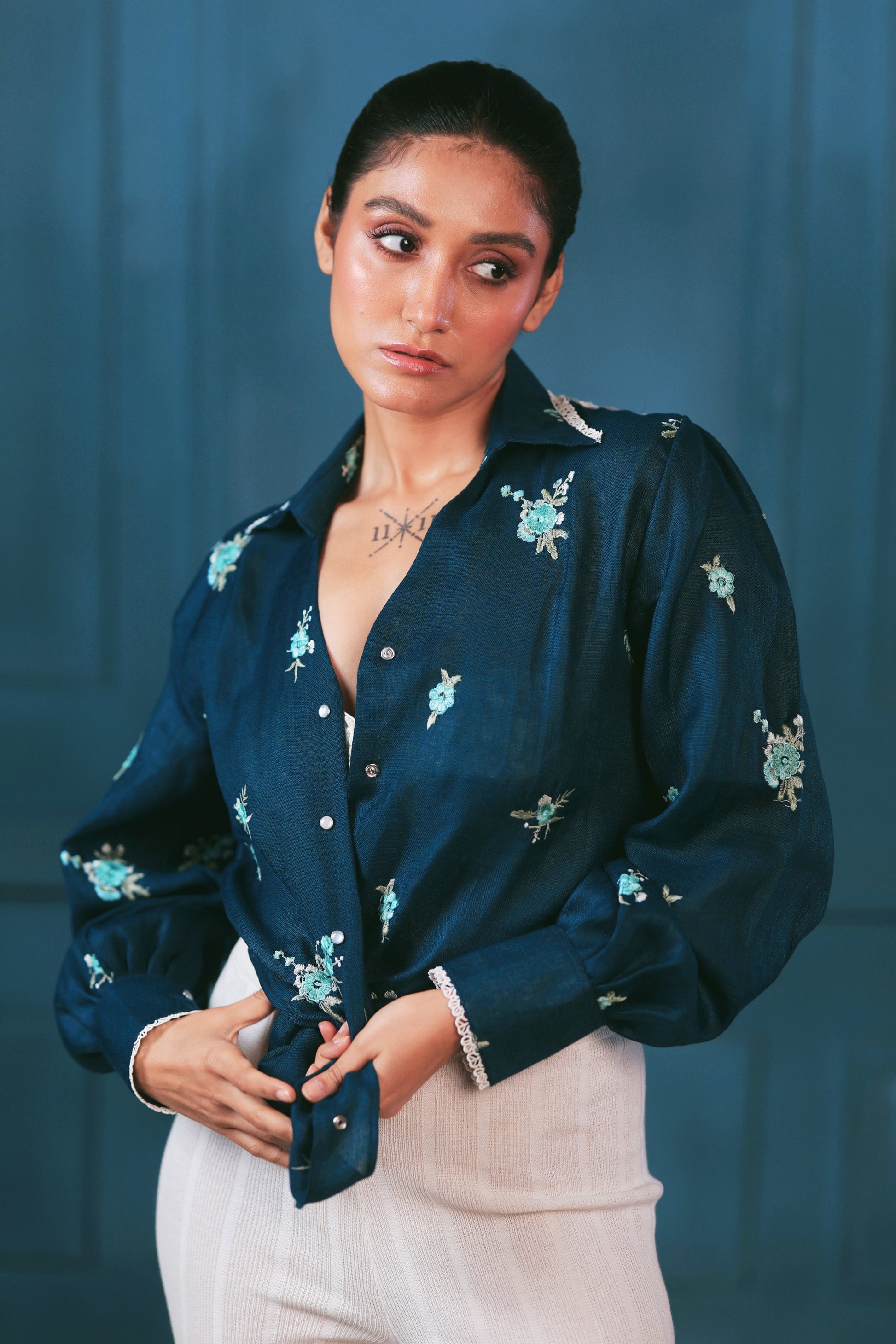 Navy Nexus oversized shirt by 66aura displayed on a hanger, showing long sleeves, collar, and relaxed fit.