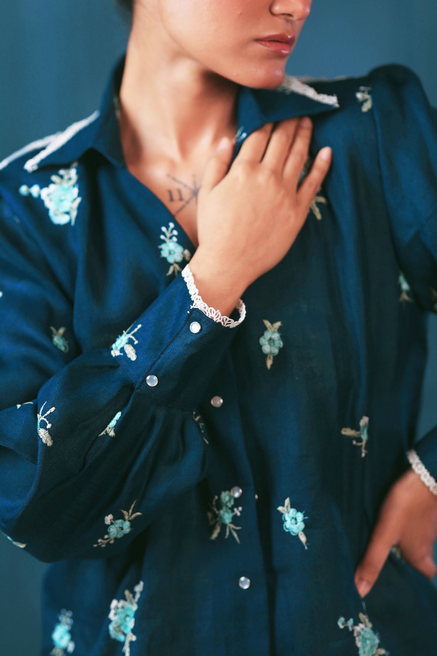 Navy Nexus oversized shirt by 66aura displayed on a hanger with a relaxed fit and button-up front.