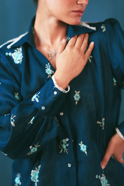 Navy Nexus oversized shirt by 66aura displayed on a hanger with a relaxed fit and button-up front.