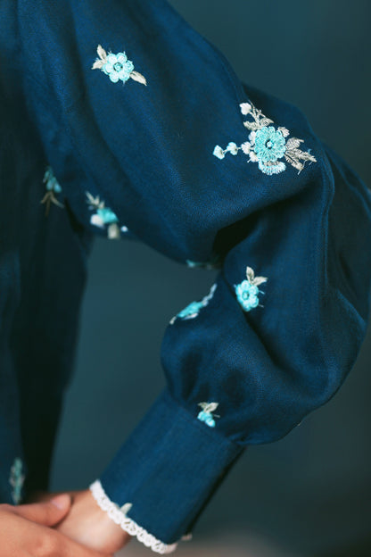 Navy Nexus oversized shirt by 66aura, featuring a relaxed fit, long sleeves, and casual style, displayed on a hanger.