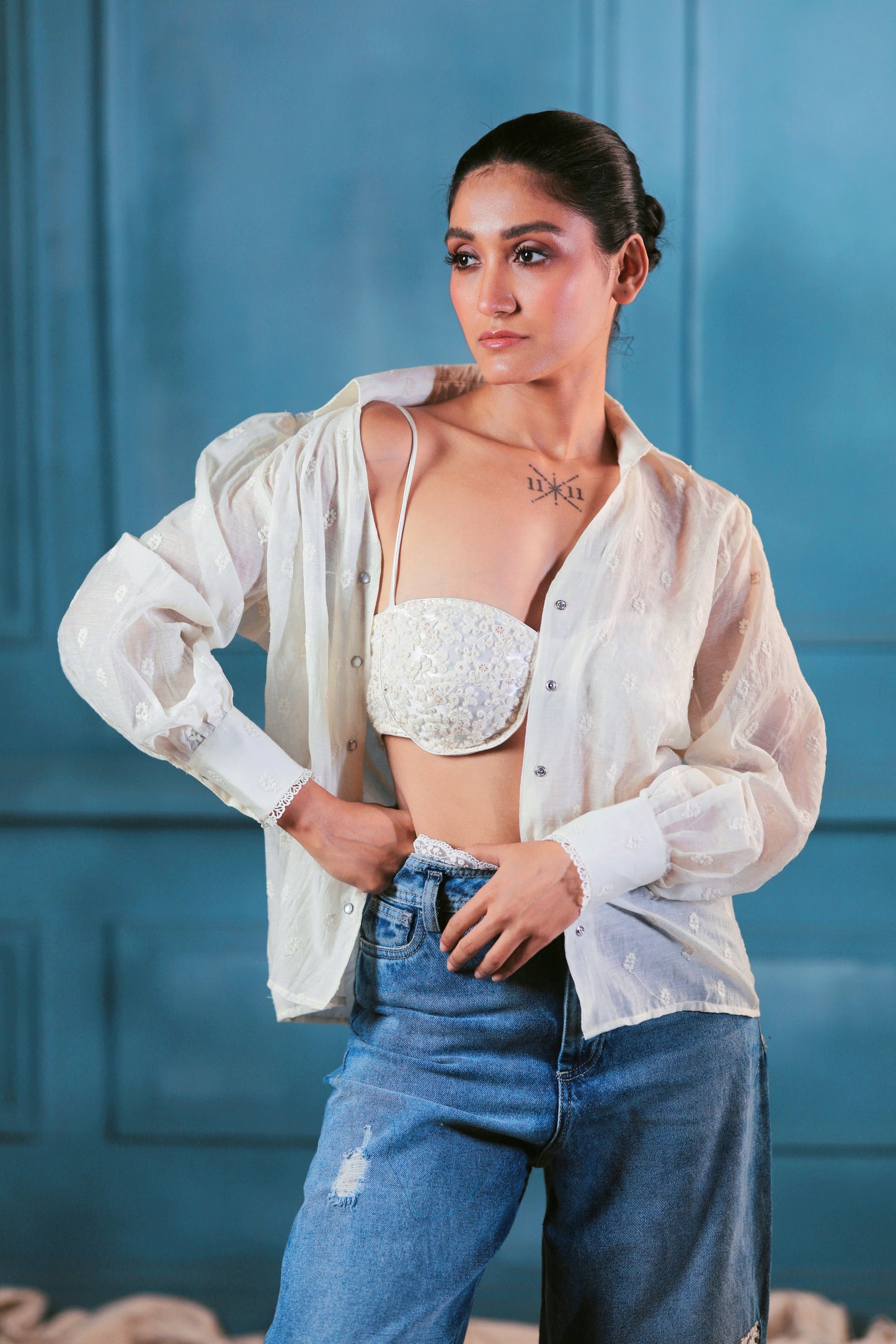 Oversized cloud craft shirt by 66aura displayed on a hanger with cloud pattern fabric and relaxed fit style.