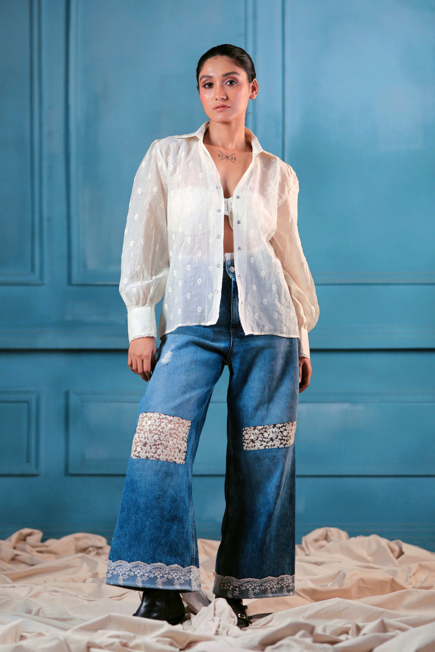 Oversized cloud craft shirt by 66aura displayed on a hanger, featuring soft fabric and relaxed fit in neutral tones.
