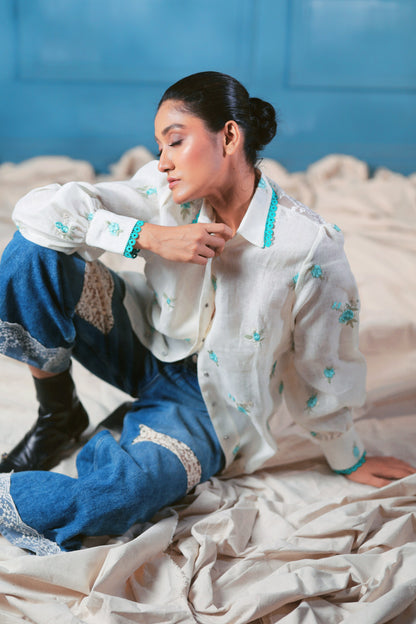 Oversized Chill Charm shirt by 66aura, featuring a relaxed fit with soft fabric and stylish design, displayed on a hanger.