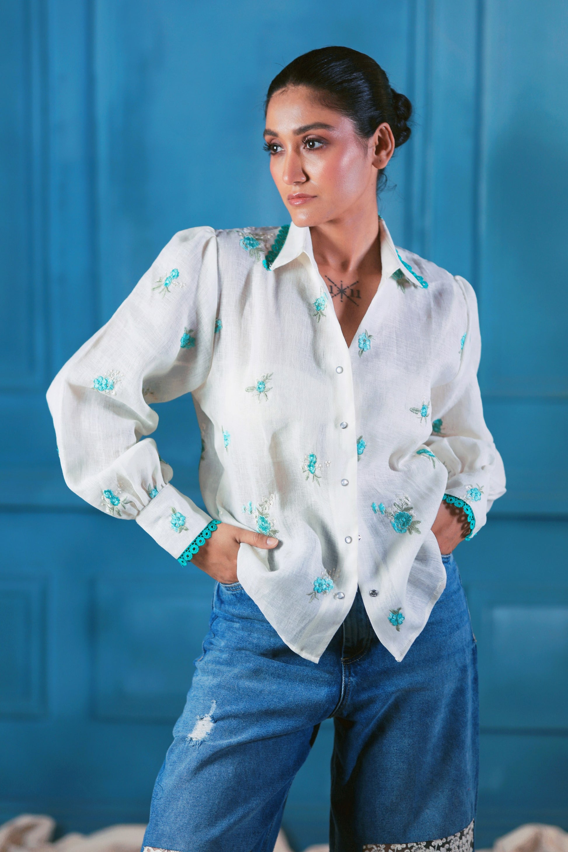 Oversized CHILL CHARM shirt by 66aura in soft fabric, featuring a relaxed fit and stylish design, displayed on a hanger.
