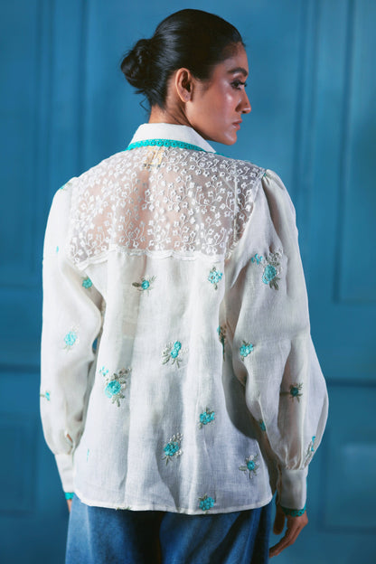 Oversized Chill Charm shirt by 66aura featuring a relaxed fit and stylish design, displayed on a hanger.