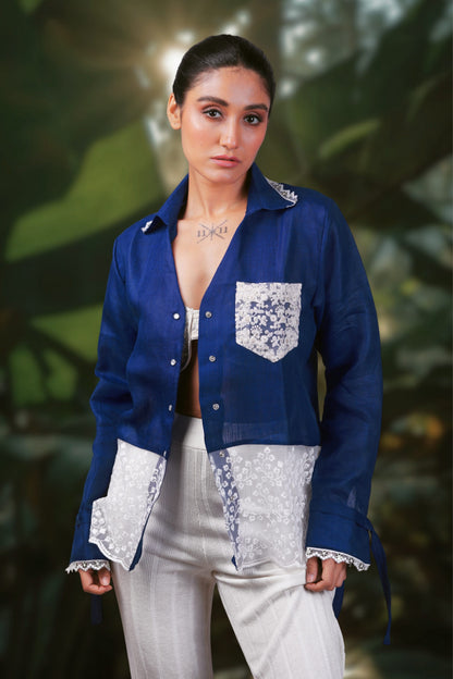 Model wearing a cobalt crush oversized shirt by 66aura, styled with a neutral background and casual accessories.