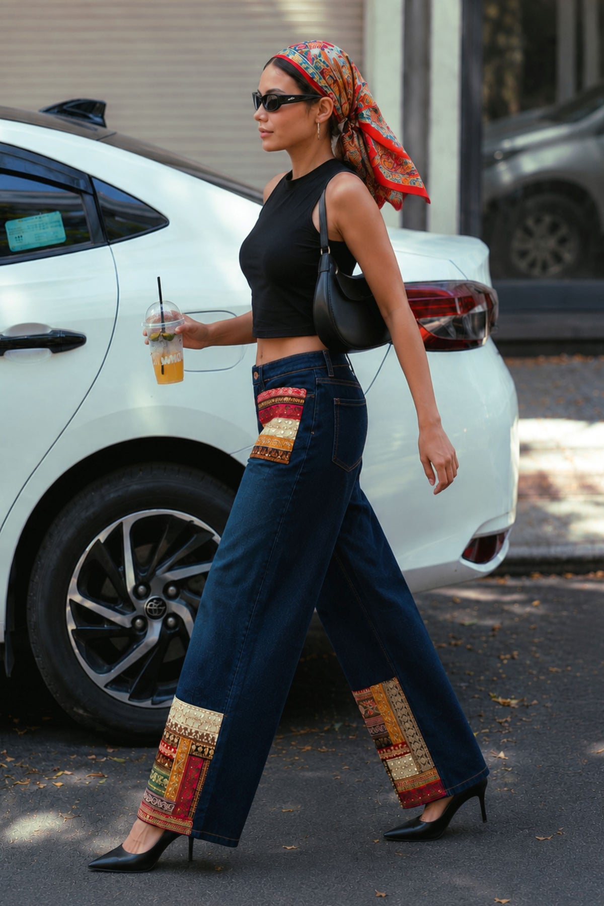 Pair of 66aura Too Iconic jeans in multi-tone denim with classic five-pocket design and straight-leg fit.