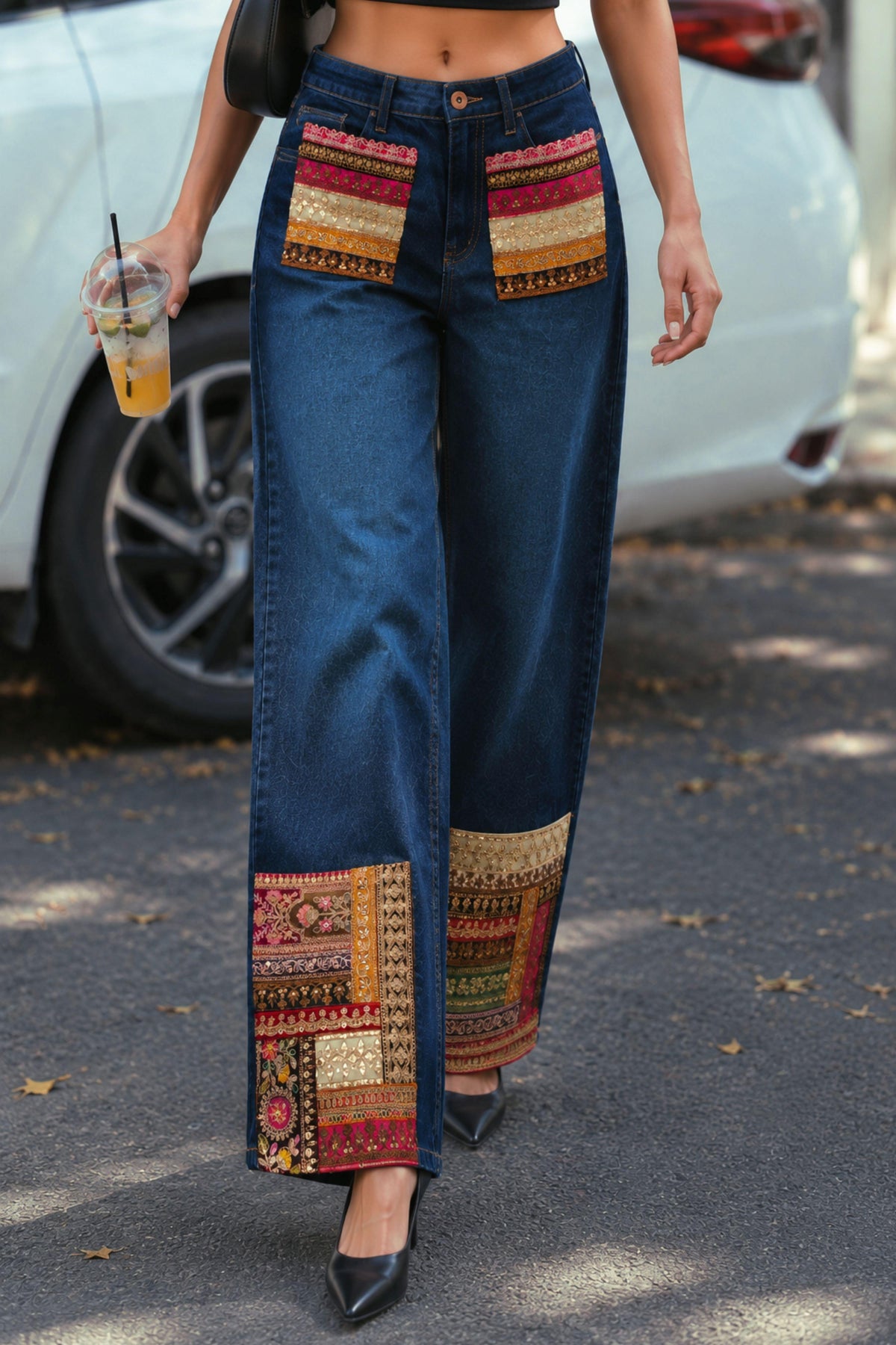 Slim fit Too Iconic jeans by 66aura in dark denim with five pockets and stylish stitching, displayed on a hanger.