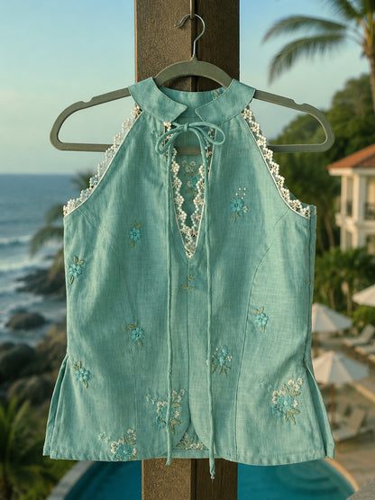 Mint sky Tuscany Tide Top by 66aura, featuring lightweight fabric and a relaxed fit, displayed on a hanger.