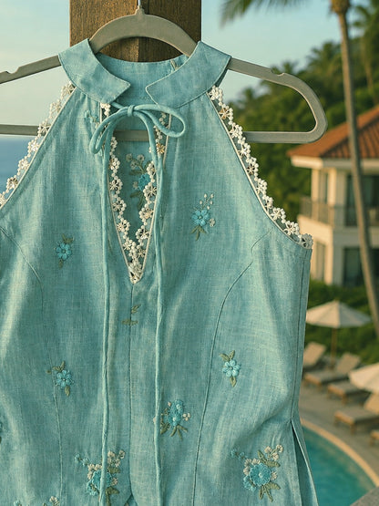 Mint blue Tuscany Tide Top by 66aura, featuring lightweight fabric and a relaxed fit, displayed on a hanger against a plain background.
