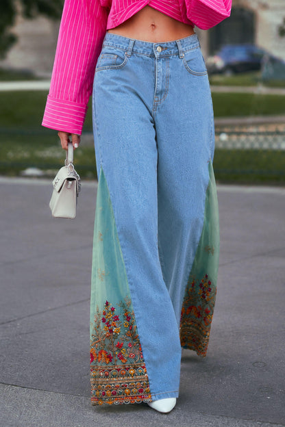 Light blue summer fling jeans by 66aura featuring a relaxed fit and classic denim design, shown hanging on a wooden background.